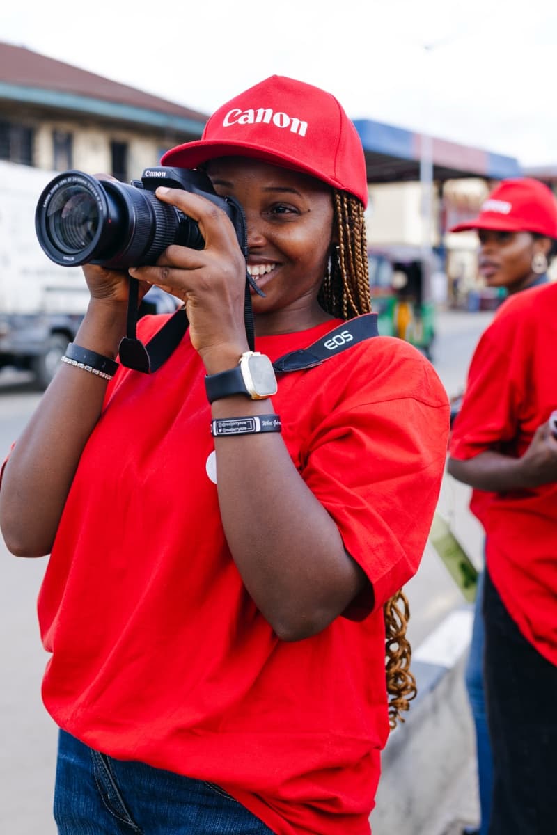 HerLens Cohort 1 participant photographing on location with a Canon camera