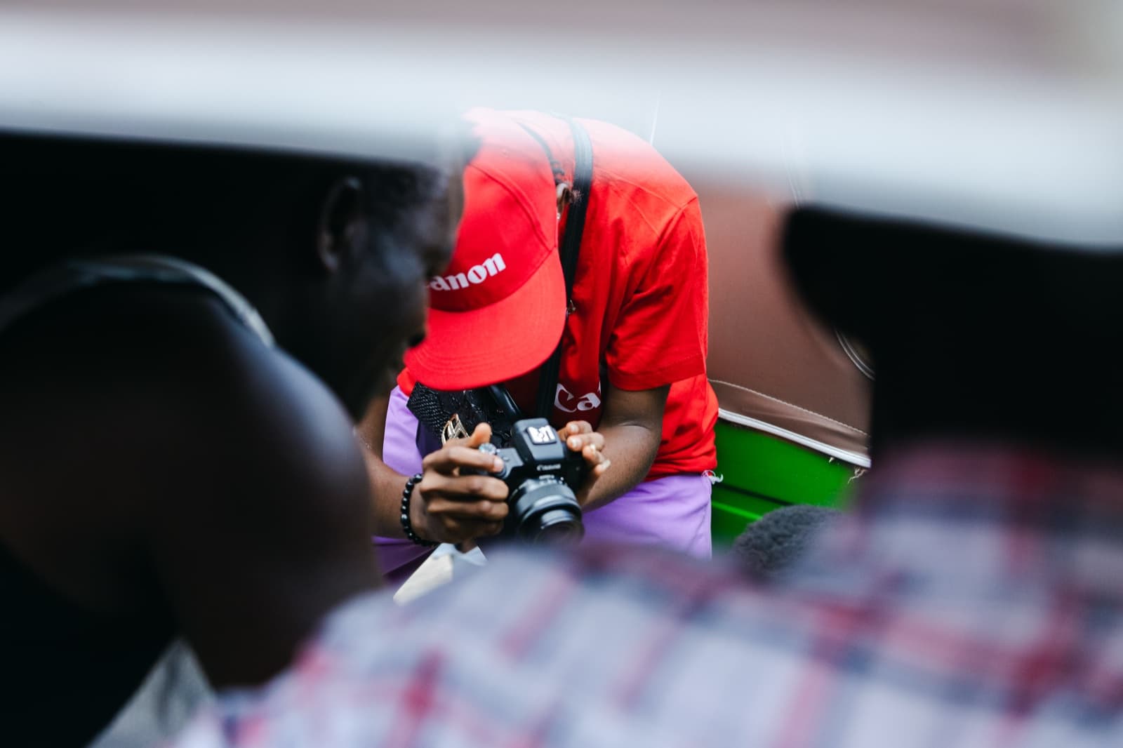 HerLens Cohort 1 participant framing a shot during fieldwork