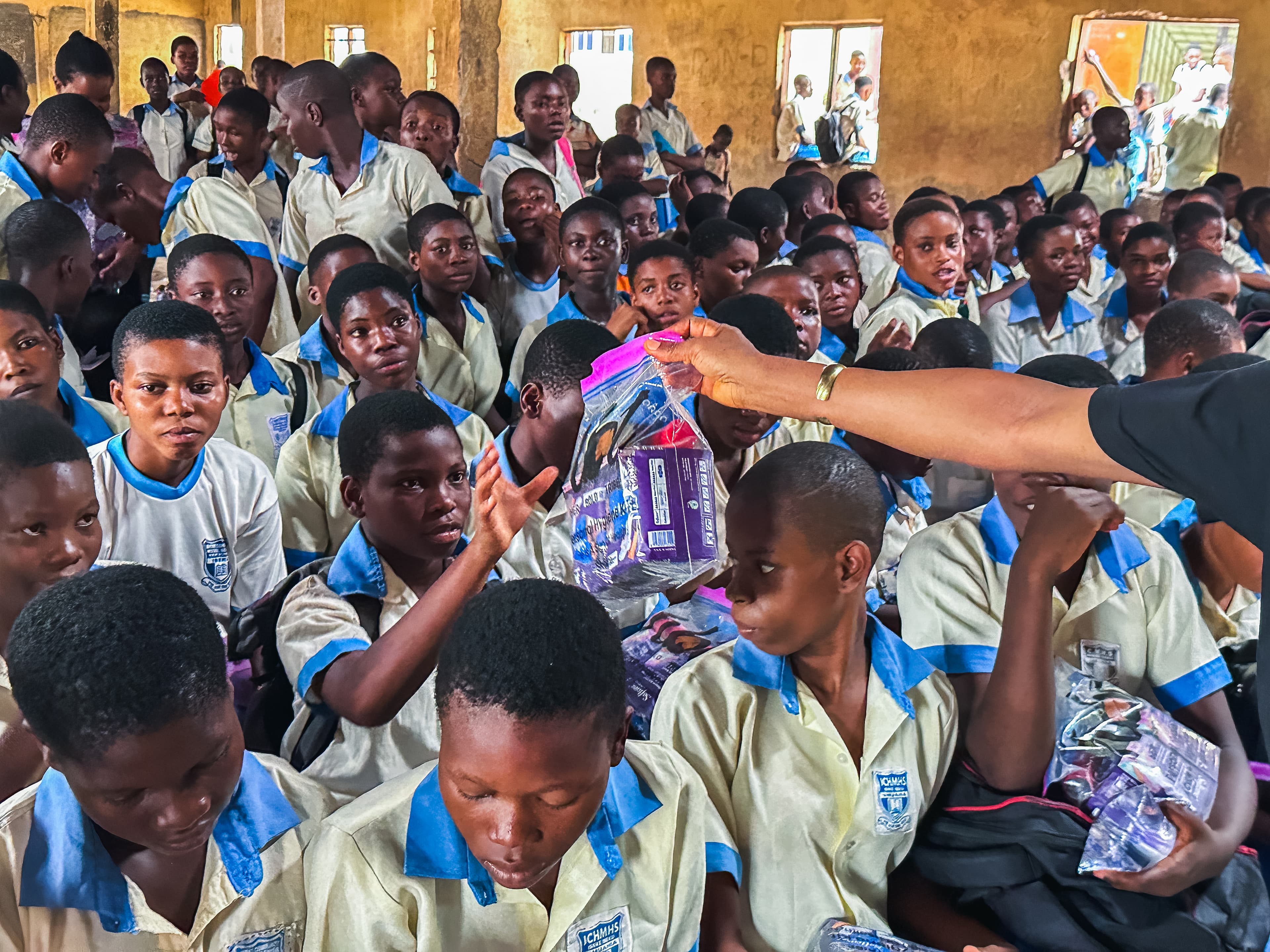 Girls receiving hygiene kits at Ishieke High School